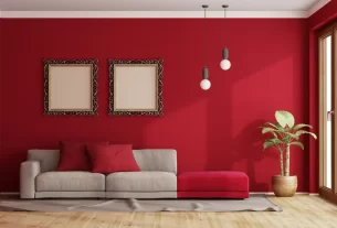 Sala decorada com paleta de cores 2025 vermelho cereja.