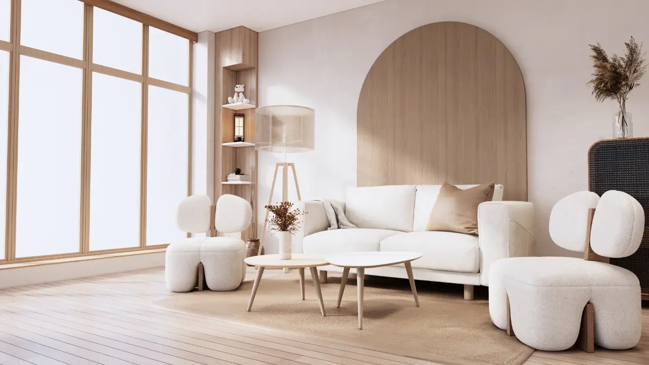 Detalhe de um ambiente com parede na cor greige, um vaso de cerâmica com galhos secos e um móvel de madeira clara, representando a combinação Japandi.