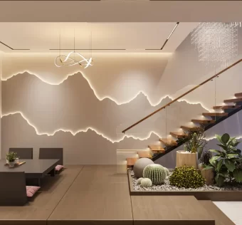 Sala de estar decorada com a cor greige na parede, um sofá branco, almofadas texturizadas e uma mesa de centro de madeira, exemplificando a tendência greige.