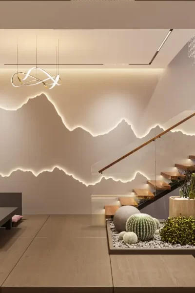 Sala de estar decorada com a cor greige na parede, um sofá branco, almofadas texturizadas e uma mesa de centro de madeira, exemplificando a tendência greige.